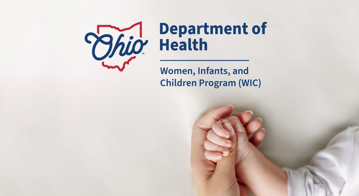 Mother holding baby's hand with WIC logo