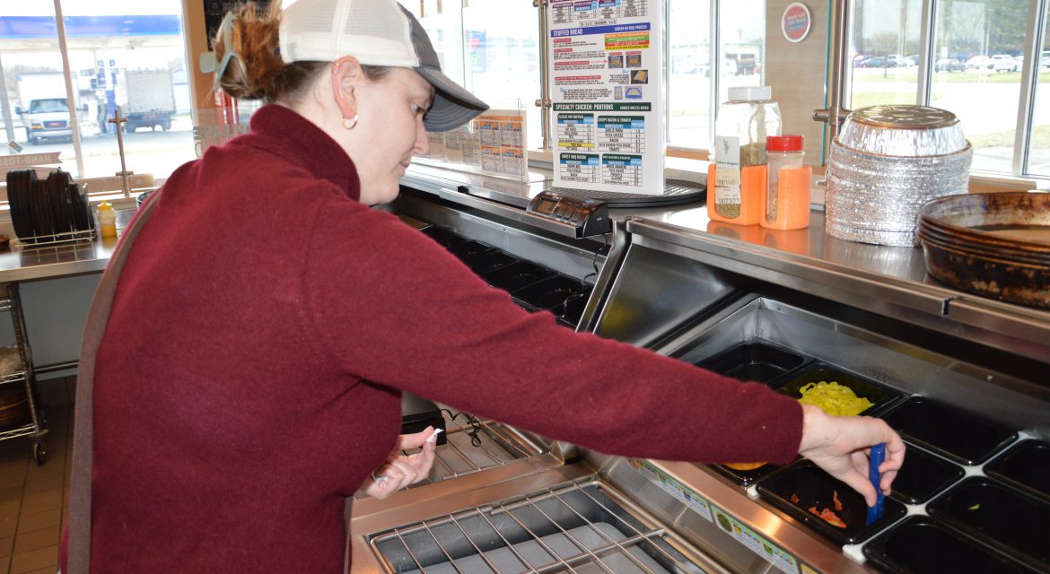 Health inspector inspecting food truck