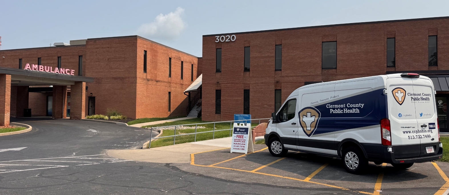 Harm reduction mobile van parked outside clinic entrance